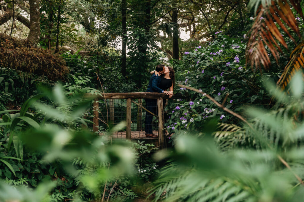 a couple kisses in a park - engagement session guide