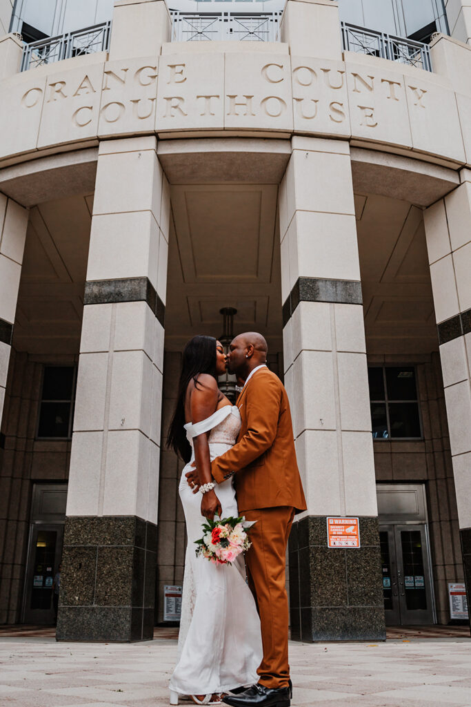 a couple getting eloped in Orange County Courthouse in Florida. shot by Shannon Lee, a florida elopement photographer